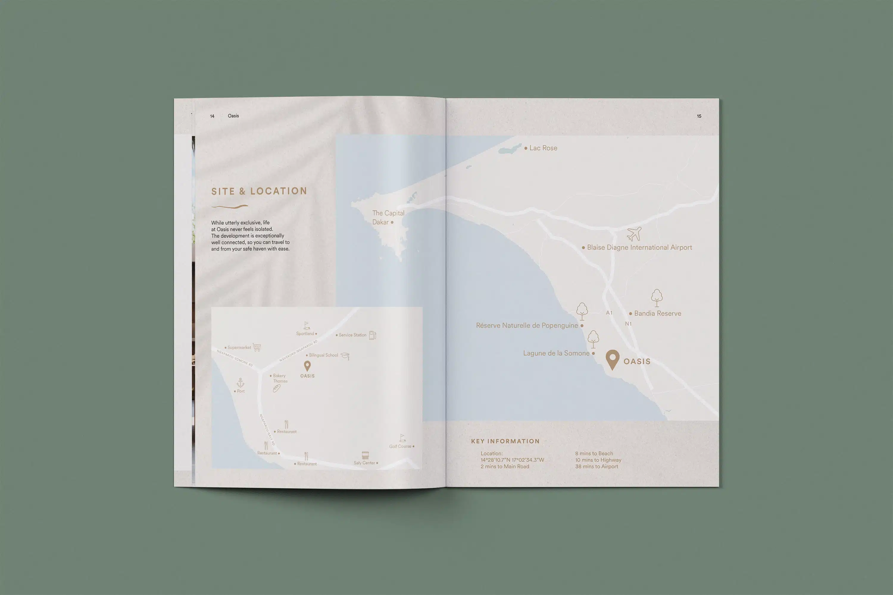 Open spread of the Dune Signature Oasis brochure, featuring a map showing the site and location of the villas. The left page includes the text 'SITE & LOCATION' and a paragraph of descriptive text, along with a smaller inset map. The right page features a larger map with location markers, including 'OASIS', 'Laguna de la Doncela', 'Bissau-Ogone International Airport', and 'Bandasave'. A section at the bottom right is labeled 'KEY INFORMATION'. A faint palm tree shadow pattern is visible on the left page. The brochure is shown at an angle on a grey-green background.