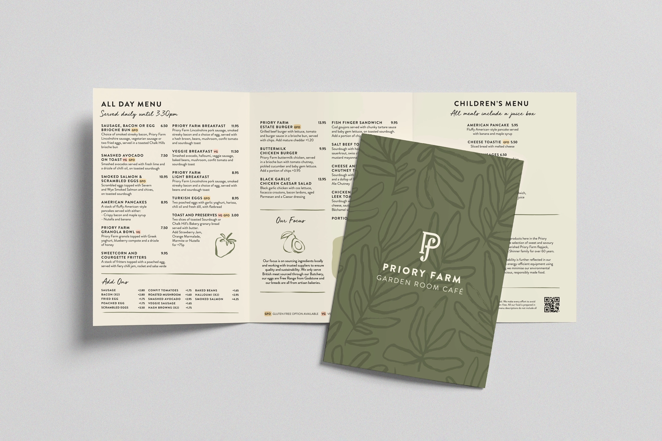 A visual of the Priory Farm Estate Garden Room Café menu, showing an open tri-fold menu with a list of food items and prices, and a separate card featuring the café's branding. The card has a green background with a leaf pattern and the Priory Farm 'P f' logo, along with the words 'GARDEN ROOM CAFÉ'.